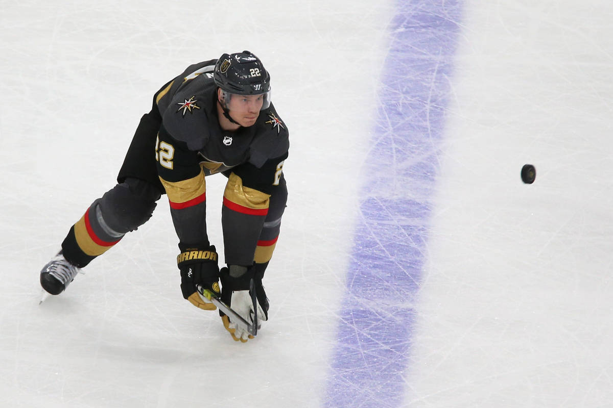 Vegas Golden Knights defenseman Nick Holden (22) reaches for a puck during the second period of ...