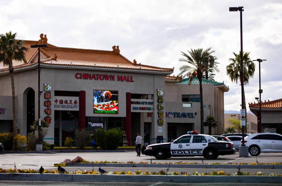 A Las Vegas police car sits in the parking lot of Chinatown Plaza on Saturday, March 21, 2020, ...