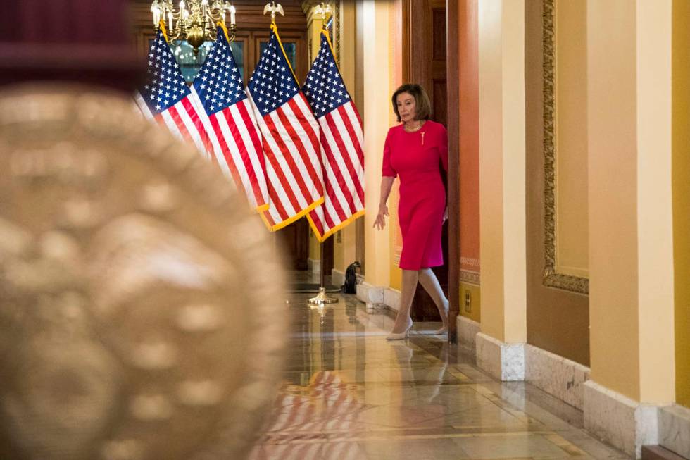 House Speaker Nancy Pelosi of Calif. arrives to read a statement outside her office on Capitol ...