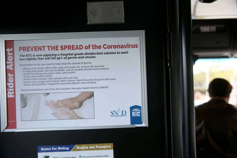 A coronavirus informational sign on a Regional Transportation Commission bus at the Sunset Main ...