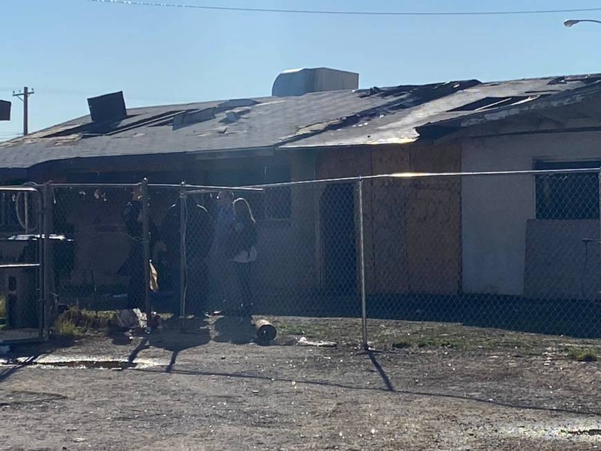 North Las Vegas police and fire inspectors investigate a fatal fire on Friday, Feb. 7, 2020, at ...
