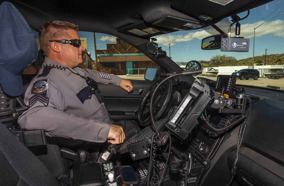 Nevada State Trooper Sgt. Wayne Dice monitors traffic speeds along U.S. 95 on Tuesday, March 24 ...