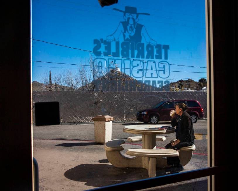 A customer enjoys some coffee and a smoke outside of the Terrible's Casino gas station on Tuesd ...