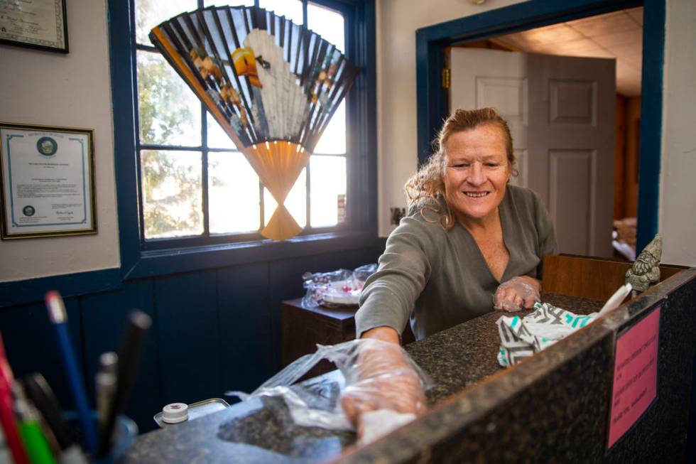 Carol Morgan cleans inside the BV Motel to help keep the threat of coronavirus to a minimum on ...