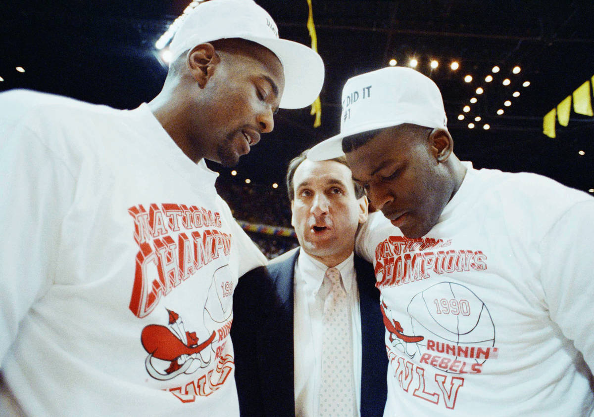 Duke coach Mike Krzyzewsik officer his congratulations to UNLV players Stacey Augmon, left, and ...