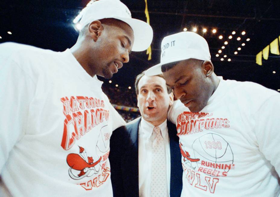 Duke coach Mike Krzyzewsik officer his congratulations to UNLV players Stacey Augmon, left, and ...