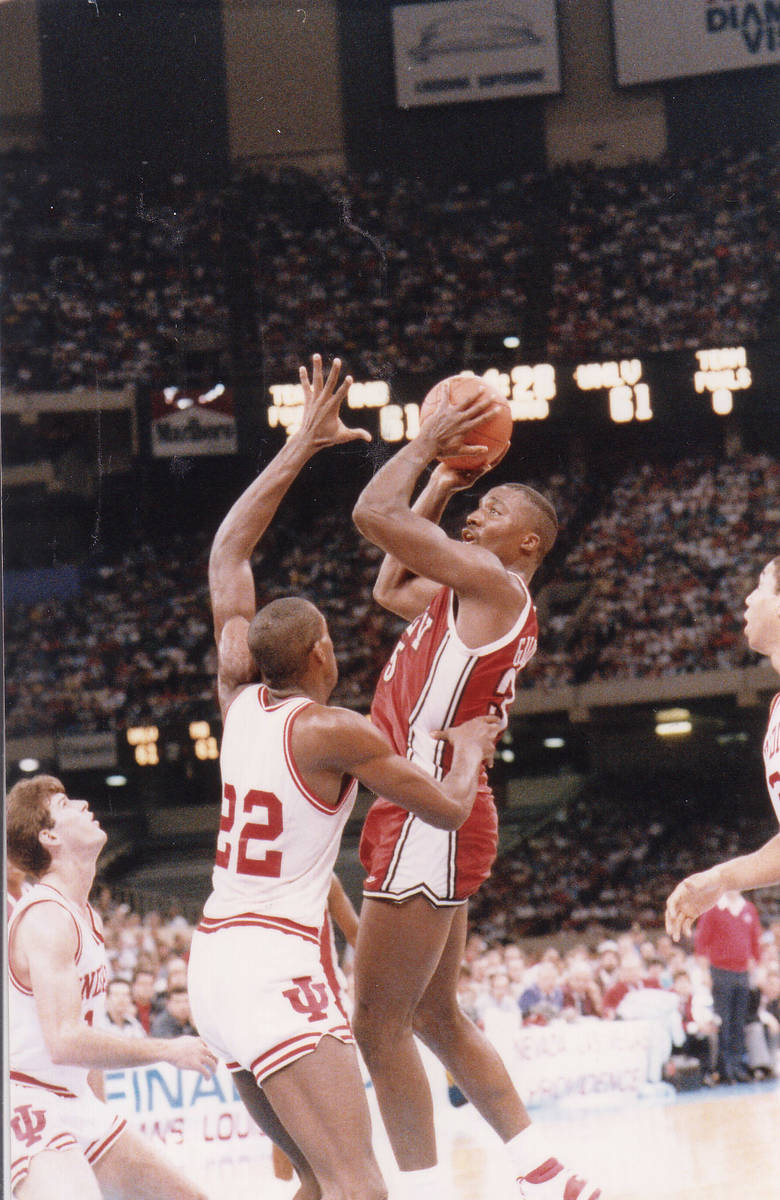 UNLV basketball player Armon Gilliam goes up over Indiana players during their NCAA Final Four ...