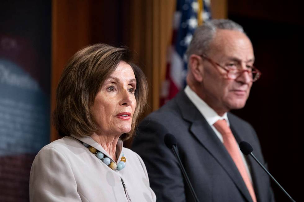 House Speaker Nancy Pelosi of Calif., joined by Senate Minority Leader Chuck Schumer of N.Y., s ...