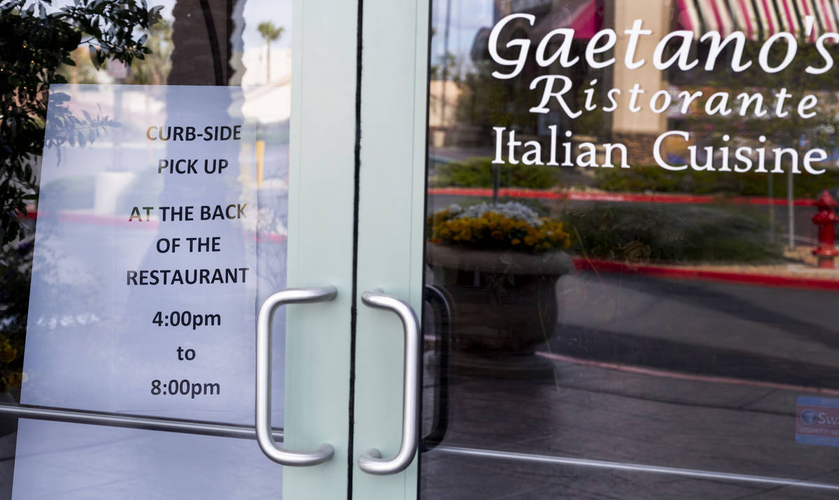 A sign is seen directing customers to the rear of Gaetano's Ristorante for curbside pickup at G ...