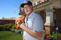 Mike Guerra is photographed with his Hank Bauer model glove at his Las Vegas home, Tuesday, Mar ...