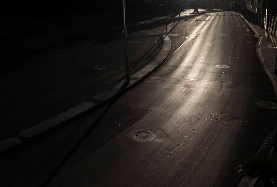 West Harmon Avenue, in between Aria and Cosmopolitan, is empty as the sun sets on the Strip on ...