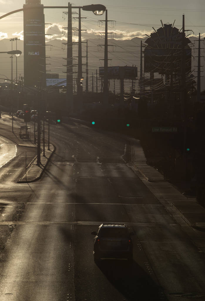 The sun sets on East Flamingo Road on the Strip on Tuesday, March 24, 2020, in Las Vegas. (Elle ...