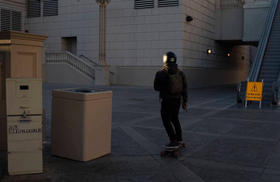 A skateboarder travels south on the Strip on Tuesday, March 24, 2020, in Las Vegas. (Ellen Schm ...