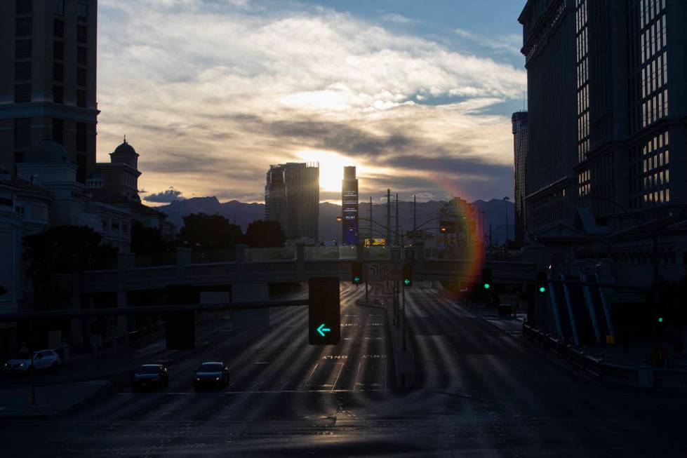 The sun sets on the Strip on Tuesday, March 24, 2020, in Las Vegas. (Ellen Schmidt/Las Vegas Re ...