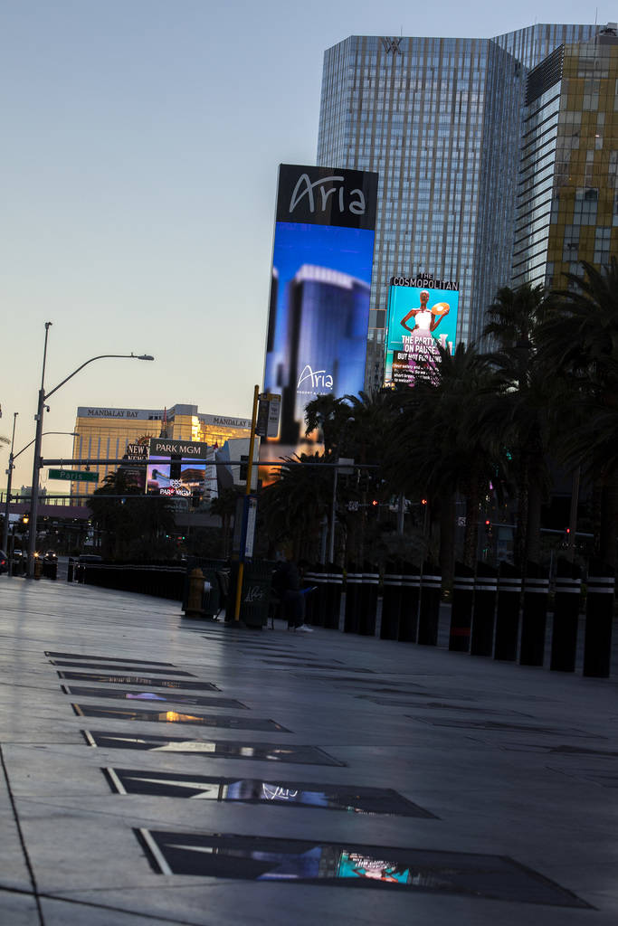 The Aria marquee reflects in the Las Vegas Walk of Stars on Tuesday, March 24, 2020, in Las Veg ...