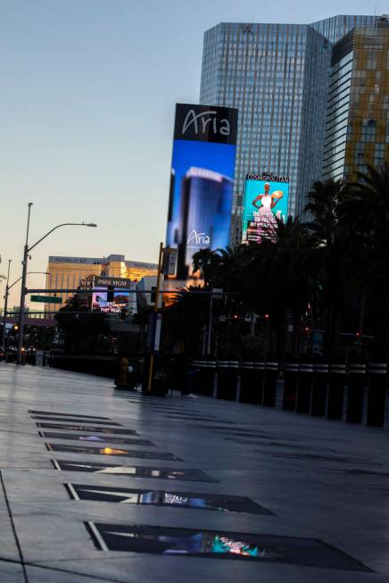 The Aria marquee reflects in the Las Vegas Walk of Stars on Tuesday, March 24, 2020, in Las Veg ...