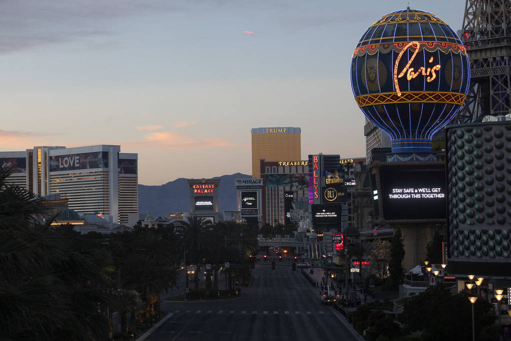 The sun sets on the Strip on Tuesday, March 24, 2020, in Las Vegas. (Ellen Schmidt/Las Vegas Re ...