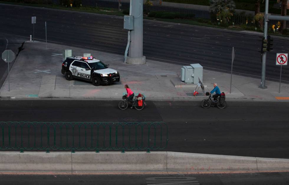 Bikers travel through the vacant Strip on Tuesday, March 24, 2020, in Las Vegas. (Ellen Schmidt ...