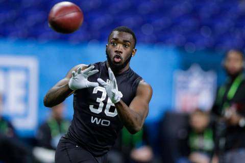 Baylor wide receiver Denzel Mims runs a drill at the NFL football scouting combine in Indianapo ...