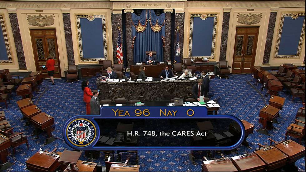 In this image from video, the final vote of 96-0 shows passage of the $2.2 trillion economic re ...