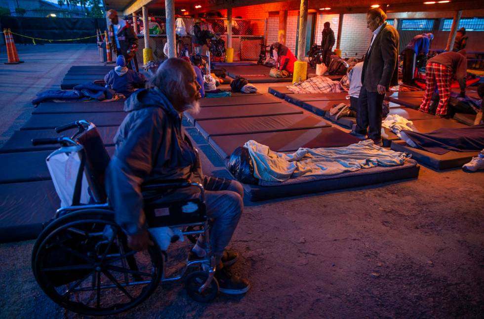 Men are directed to their mats for the night at the Courtyard Homeless Resource Center on Monda ...