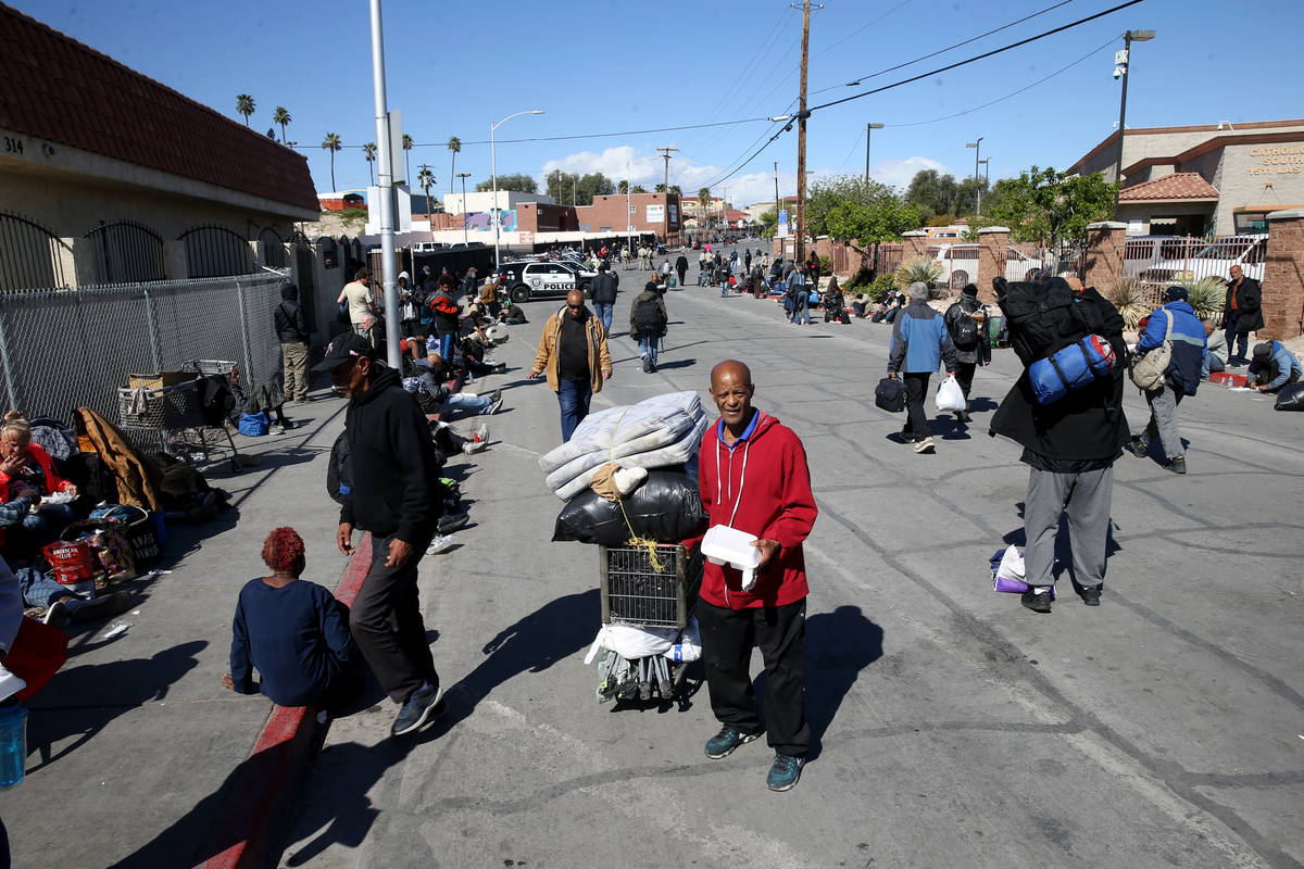 Tony Brown, 64, with his to-go lunch from Catholic Charities on Foremaster Lane in Las Vegas Th ...