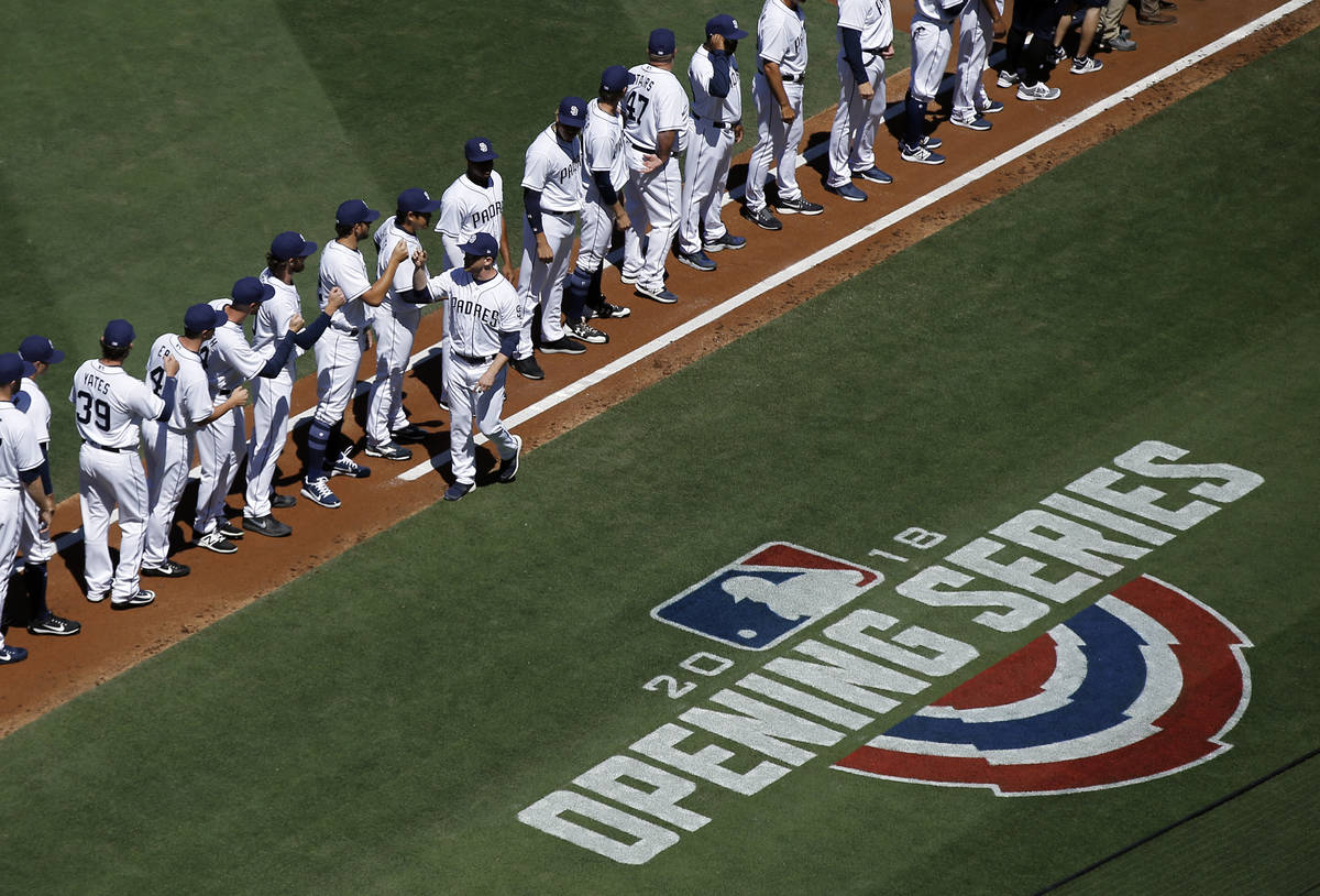 San Diego Padres manager Andy Green, center, greets his team after being introduced before an o ...