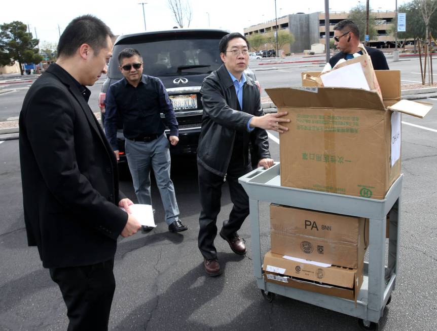 Representatives of Ohjah Japanese Steakhouse in Las Vegas load a donation to University Medical ...