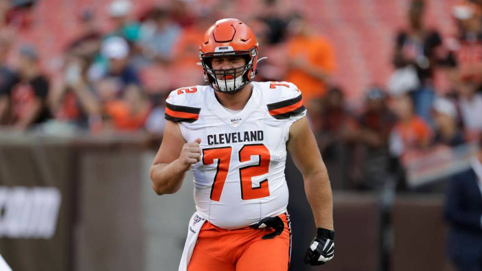 Cleveland Browns offensive guard Eric Kush warms up before an NFL preseason football game betwe ...