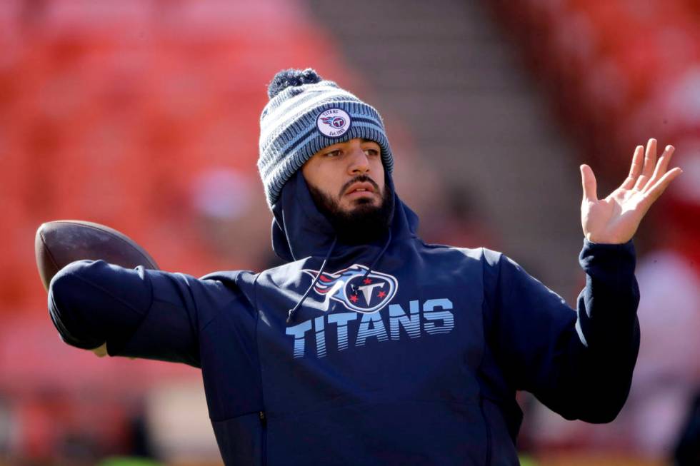 FILE - In this Jan. 19, 2020, file photo, Tennessee Titans' quarterback Marcus Mariota warms up ...