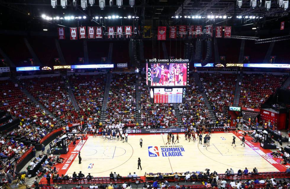 Basketball fans look on during a timeout in a game between the Cleveland Cavaliers and the New ...