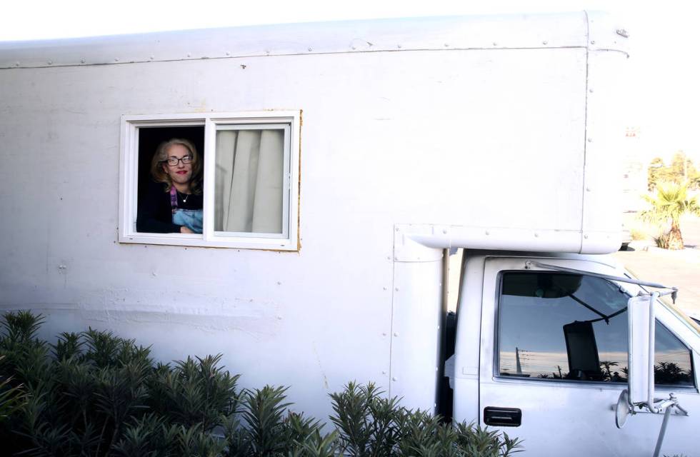 Emily-Kate Niskey, 52, with her 1994 converted U-Haul truck where she lives with her husband in ...