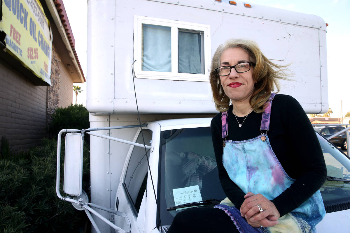 Emily-Kate Niskey, 52, with her 1994 converted U-Haul truck where she lives with her husband in ...