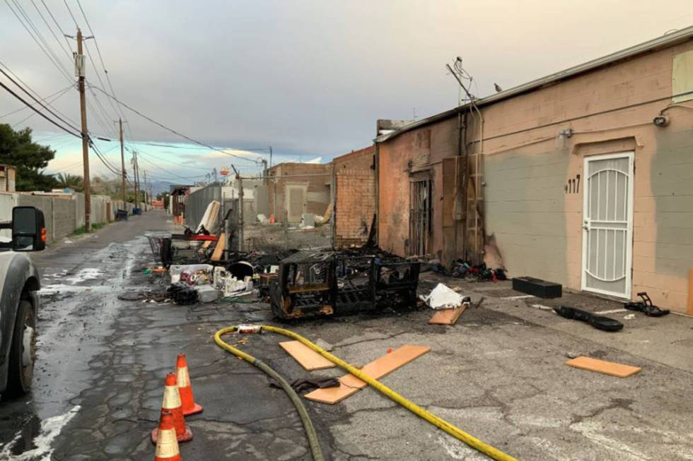 Crews battle a fire Sunday, March 29, 2020, in an alley on the 4100 block of West Sahara Avenue ...