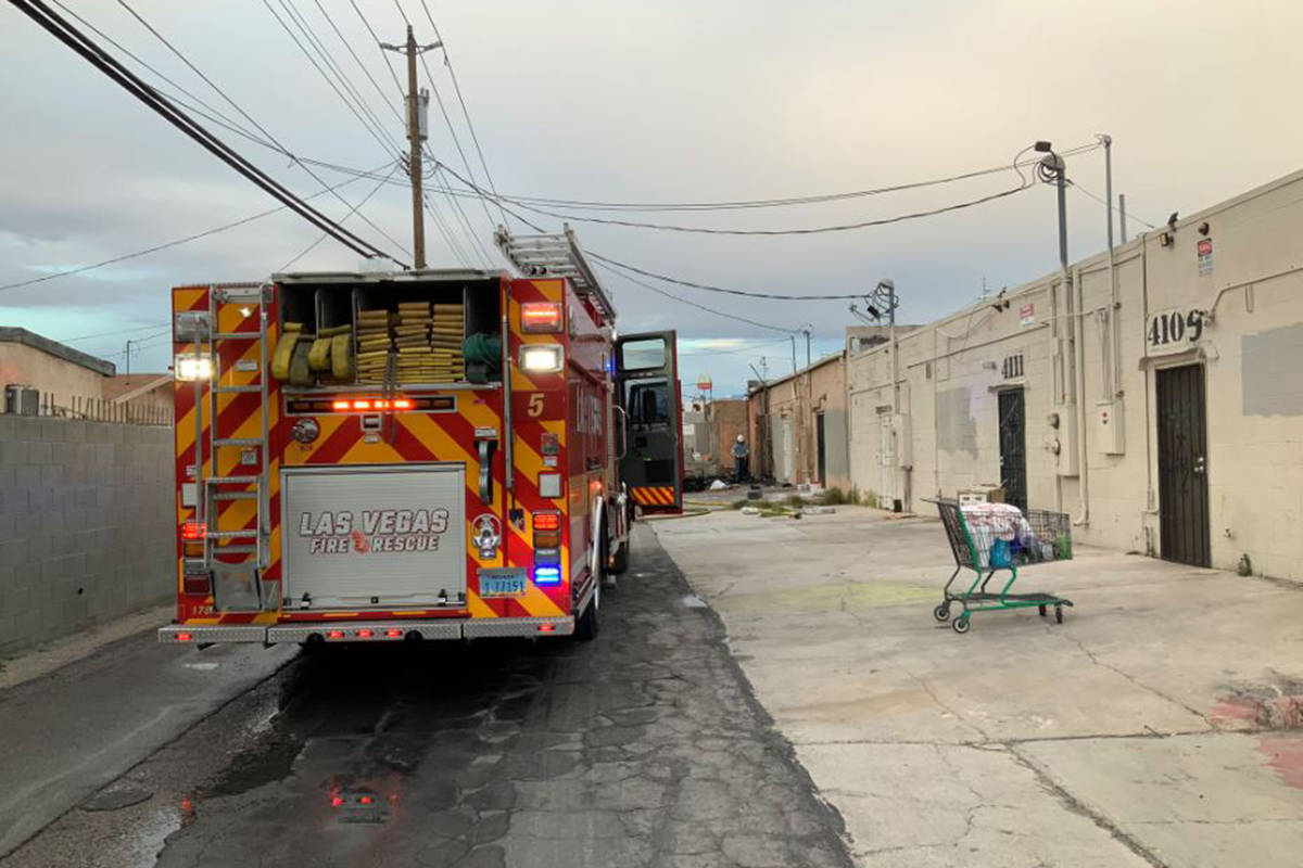 Crews battle a fire Sunday, March 29, 2020, in an alley on the 4100 block of West Sahara Avenue ...