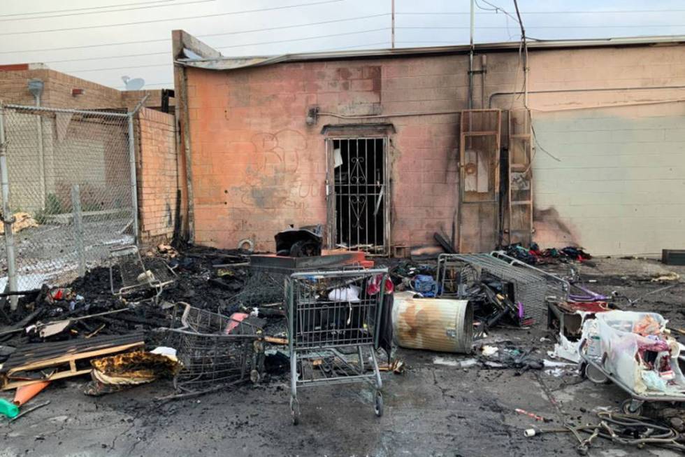 Crews battle a fire Sunday, March 29, 2020, in an alley on the 4100 block of West Sahara Avenue ...