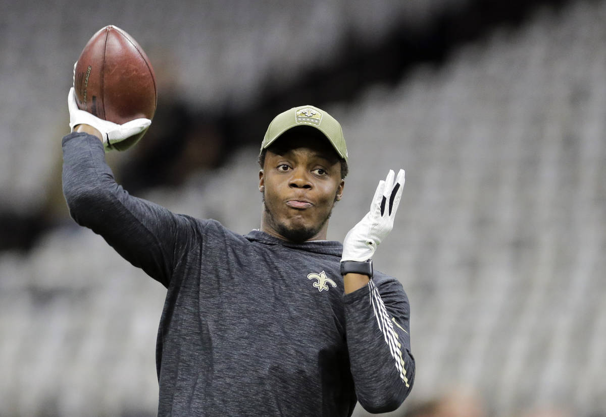 FILE - In this Nov. 10, 2019, file photo, New Orleans Saints quarterback Teddy Bridgewater thro ...