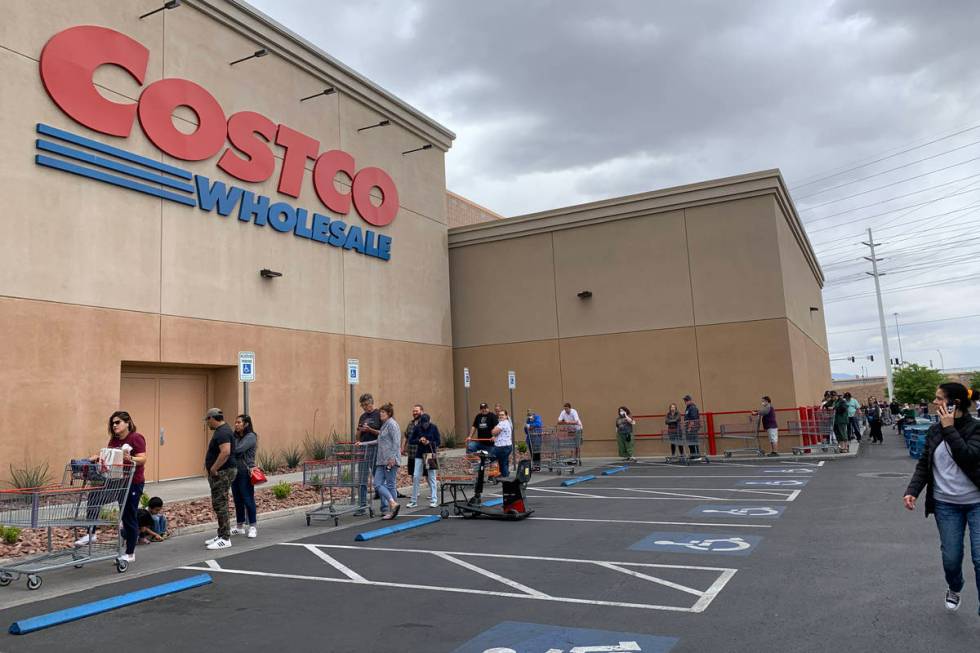 People wait in line in front of Costco at 791 Marks St, in Henderson, Sunday, March 29, 2020. ...
