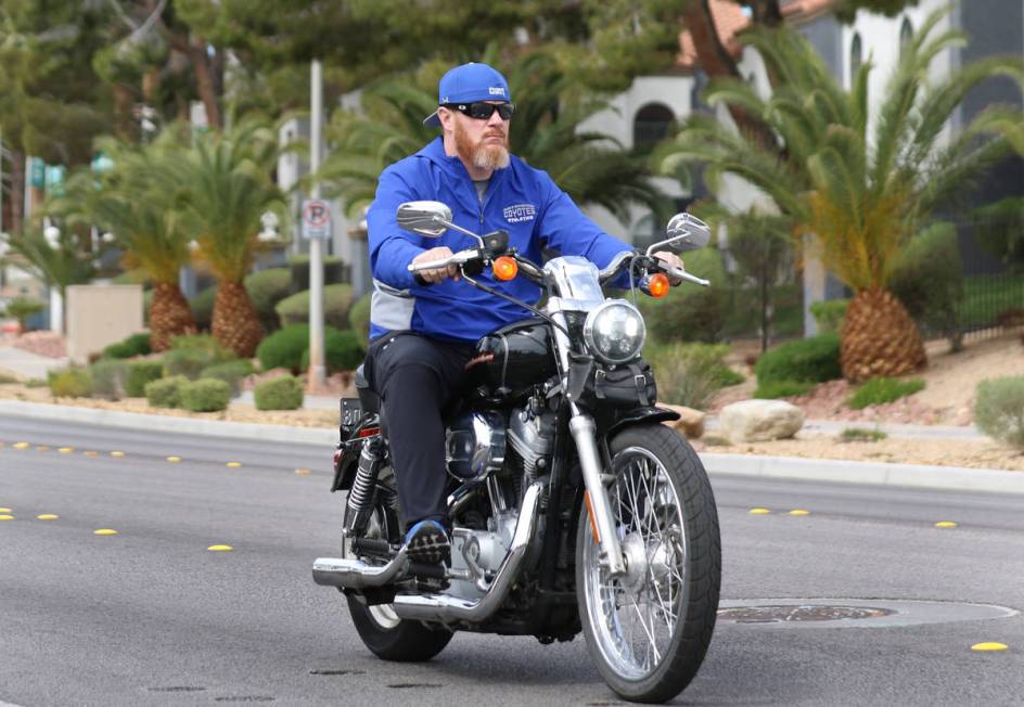 The New CSN men's basketball coach Russ Beck rides his motorcycle on High View Drive on Wednesd ...