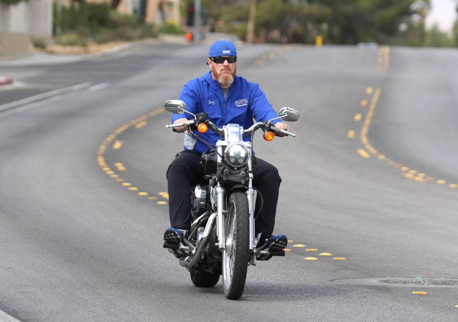 The New CSN men's basketball coach Russ Beck rides his motorcycle on High View Drive on Wednesd ...