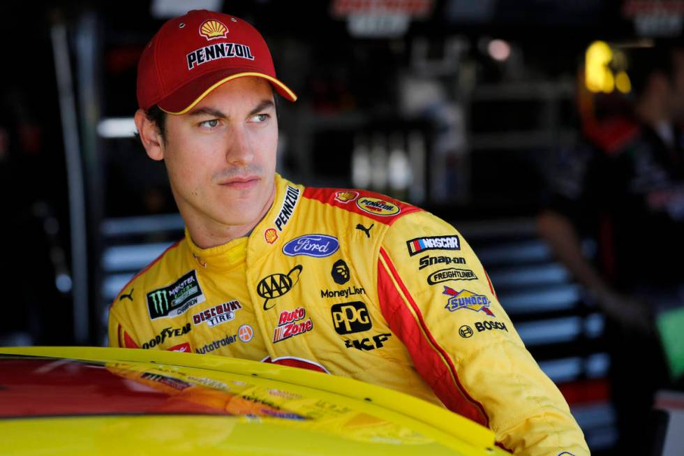 FILE - In this Oct. 18, 2019, file photo, NASCAR driver Joey Logano climbs into his car to prac ...