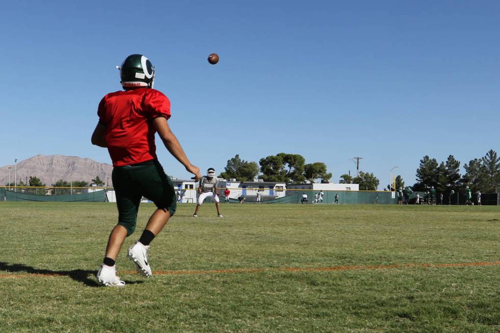 Rancho High School quarterback Ruben Vasquez throws the football as the football team practices ...