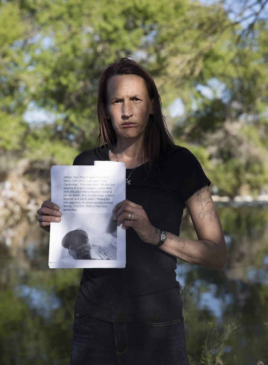 Wendy Cox holds a flier to find her missing partner, William "Sky" Pilgrim, at the Clark County ...