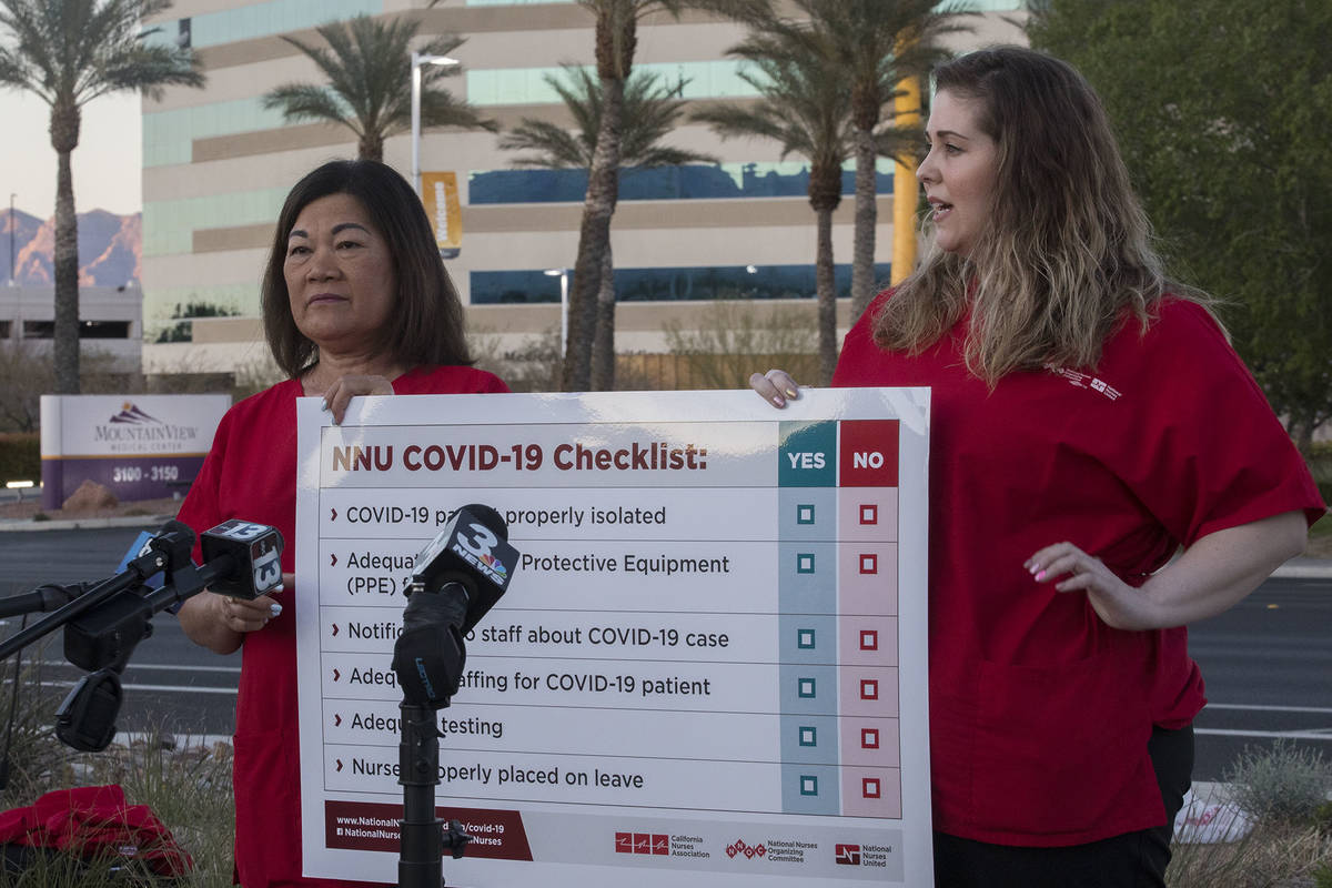 Dina Armstrong, a nurse and chief nurse for National Nurses Untied, left, addresses the media a ...