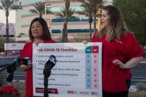 Dina Armstrong, a nurse and chief nurse for National Nurses Untied, left, addresses the media a ...