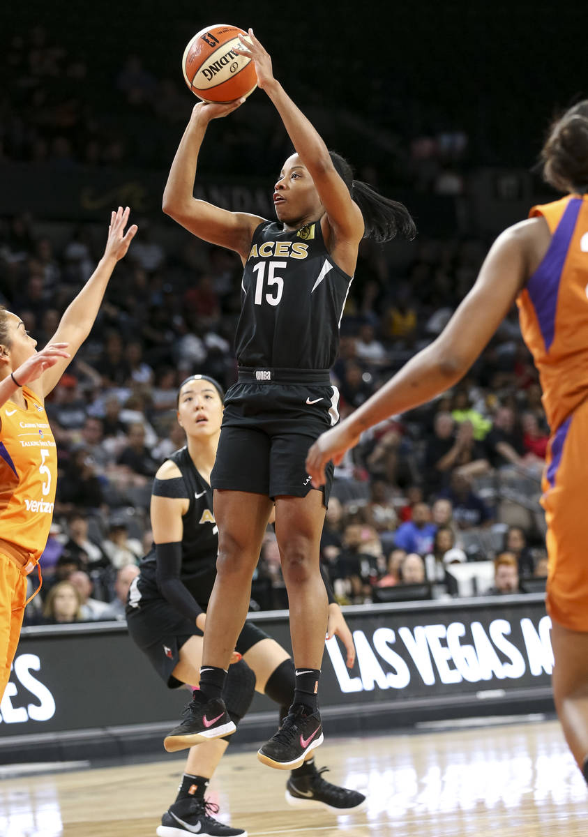 Las Vegas Aces guard Lindsay Allen (15) shoots over Phoenix Mercury guard Leilani Mitchell (5) ...