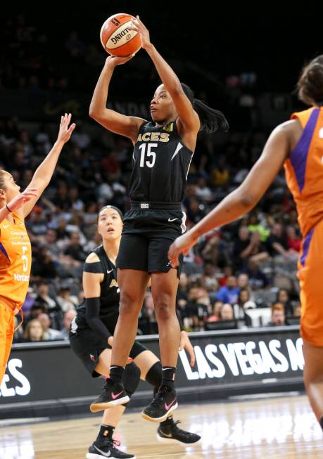 Las Vegas Aces guard Lindsay Allen (15) shoots over Phoenix Mercury guard Leilani Mitchell (5) ...