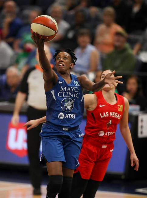 Minnesota Lynx guard Danielle Robinson (3) puts up a first half shot up after driving past Las ...