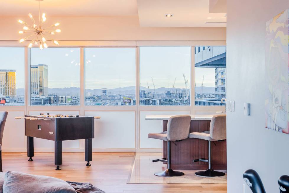 An area by the kitchen has been turned into a place for games. (Red Luxury Real Estate)