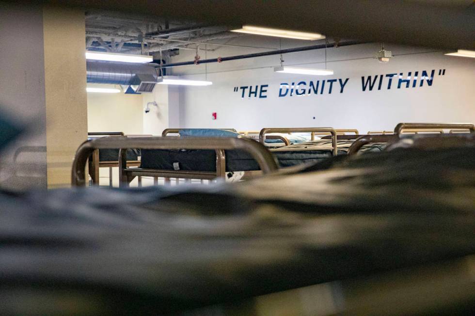 Rows of bunkbeds are seen with mattresses removed from multiple in effort to practice social di ...